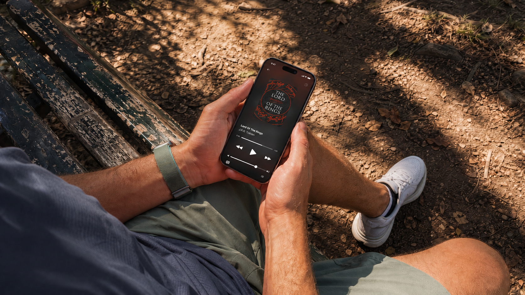 Listening to The Lord of the Rings on a park bench